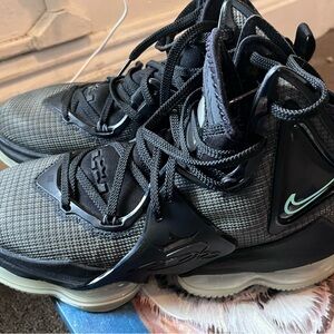 USED Nike Black and Gray High Top Sneakers
Black Green Glow Color Scheme